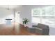Bright, minimalist living and dining room area with hardwood floors and lots of light at 532 Oakside Pl, Acworth, GA 30102