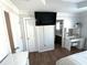 Main bedroom with TV, vanity area, and adjacent bathroom with good light at 532 Oakside Pl, Acworth, GA 30102