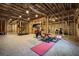 Spacious unfinished basement features exposed beams, work out equipment, and potential for customization at 2603 Apple Valley Ne Rd, Brookhaven, GA 30319