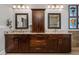 Elegant bathroom with dual vanities, granite countertops, dark wood cabinetry, and modern lighting for a luxurious feel at 2603 Apple Valley Ne Rd, Brookhaven, GA 30319