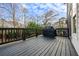 Gray painted deck features a grill for outdoor cooking and entertaining at 2603 Apple Valley Ne Rd, Brookhaven, GA 30319