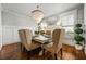 Elegant dining room featuring a chandelier, stylish chairs, and large windows for natural light at 2603 Apple Valley Ne Rd, Brookhaven, GA 30319