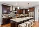 Gourmet kitchen featuring granite countertops, stainless steel appliances, and custom dark wood cabinetry at 2603 Apple Valley Ne Rd, Brookhaven, GA 30319