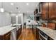 Kitchen featuring stainless steel appliances, granite countertops, and an attached eat-in area at 2603 Apple Valley Ne Rd, Brookhaven, GA 30319