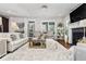 Bright living room featuring a cozy fireplace, plush rug, and elegant decor that create an inviting atmosphere at 2603 Apple Valley Ne Rd, Brookhaven, GA 30319