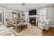 Comfortable living room with a fireplace, plush rug, and stylish furniture at 2603 Apple Valley Ne Rd, Brookhaven, GA 30319