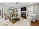 Inviting living room with fireplace, modern decor, and comfortable seating, perfect for relaxing and entertaining guests at 2603 Apple Valley Ne Rd, Brookhaven, GA 30319