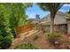 Backyard featuring a privacy fence, terraced landscaping and mature foliage at 4652 Prater Se Way, Smyrna, GA 30080