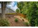 Backyard featuring a privacy fence, terraced landscaping and mature foliage at 4652 Prater Se Way, Smyrna, GA 30080