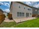 Spacious backyard features a brick patio, manicured lawn, and fenced perimeter at 4652 Prater Se Way, Smyrna, GA 30080