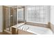 Bathroom with standalone tub and glass enclosed shower at 4652 Prater Se Way, Smyrna, GA 30080
