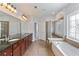 Spacious bathroom features double vanity, soaking tub and glass enclosed shower at 4652 Prater Se Way, Smyrna, GA 30080
