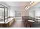 Primary bathroom featuring double vanity, standalone tub and glass enclosed shower at 4652 Prater Se Way, Smyrna, GA 30080