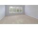 Bright bedroom featuring carpet flooring and natural light from multiple windows at 4652 Prater Se Way, Smyrna, GA 30080