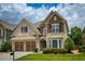 Charming two-story home featuring a well-manicured lawn and a two-car garage at 4652 Prater Se Way, Smyrna, GA 30080