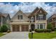 Attractive two-story home with a two-car garage, lush lawn, and inviting curb appeal at 4652 Prater Se Way, Smyrna, GA 30080