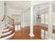 Inviting foyer showcasing hardwood floors, decorative pillars, and staircase at 4652 Prater Se Way, Smyrna, GA 30080