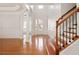 Bright foyer with hardwood floors, staircase, pillars, and natural light at 4652 Prater Se Way, Smyrna, GA 30080