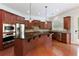 Updated kitchen features an island with seating, stainless steel appliances, and granite countertops at 4652 Prater Se Way, Smyrna, GA 30080