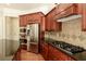 Gourmet kitchen features stainless steel appliances, granite countertops, and wood cabinetry at 4652 Prater Se Way, Smyrna, GA 30080