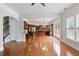 Spacious living room leads to kitchen and staircase, has hardwood floors and french doors at 4652 Prater Se Way, Smyrna, GA 30080