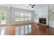 Bright living room features hardwood floors, fireplace with stone surround, and built in cabinets at 4652 Prater Se Way, Smyrna, GA 30080