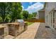 Backyard paver patio with outdoor kitchen and stainless steel grill at 4652 Prater Se Way, Smyrna, GA 30080
