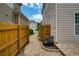 Paver walkway between homes is lined by wood fences and lush landscaping at 4652 Prater Se Way, Smyrna, GA 30080
