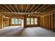 Unfinished basement with exposed framework, windows and door, offering customization potential at 553 Somersby Dr, Dallas, GA 30157