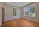 Inviting bedroom with hardwood floors, large windows, and natural light at 553 Somersby Dr, Dallas, GA 30157