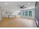 Open concept living area with a kitchen, dining space, fireplace and large windows with natural light at 553 Somersby Dr, Dallas, GA 30157