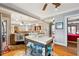 An open kitchen features hardwood floors, a butcher block island, granite countertops and modern appliances at 698 Bellemeade Nw Ave, Atlanta, GA 30318