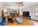Spacious living room features hardwood floors, a ceiling fan, modern furniture, and an open bar area at 698 Bellemeade Nw Ave, Atlanta, GA 30318