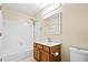 Well-lit bathroom featuring vanity and shower-tub combination at 98 Hampshire Ct, Avondale Estates, GA 30002