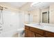 Well-maintained bathroom featuring a shower-tub combo, toilet, and vanity with wood cabinets at 98 Hampshire Ct, Avondale Estates, GA 30002