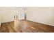 Spacious bedroom with wood-look flooring and ensuite bathroom access at 98 Hampshire Ct, Avondale Estates, GA 30002