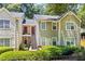 Inviting townhome with traditional architecture and landscaped front yard at 98 Hampshire Ct, Avondale Estates, GA 30002