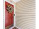 Charming front door with a welcoming wreath and neutral siding at 98 Hampshire Ct, Avondale Estates, GA 30002