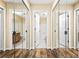 Hallway featuring mirrored closet doors and access to a bathroom at 98 Hampshire Ct, Avondale Estates, GA 30002