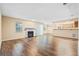 Bright living room with hardwood floors, fireplace, and sliding glass door at 98 Hampshire Ct, Avondale Estates, GA 30002