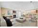 Comfortable living room with a fireplace, open to the dining and kitchen areas at 98 Hampshire Ct, Avondale Estates, GA 30002