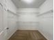 Walk-in closet with wire shelving and neutral carpet at 1850 Cotillion Dr # 2416, Atlanta, GA 30338