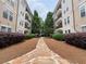 Charming courtyard featuring lush landscaping and a peaceful walkway at 1850 Cotillion Dr # 2416, Atlanta, GA 30338