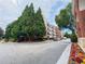 Exterior view showcasing the building's balconies and manicured landscaping at 1850 Cotillion Dr # 2416, Atlanta, GA 30338