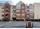 Multi-story condo building with brick facade and private balconies for residents at 1850 Cotillion Dr # 2416, Atlanta, GA 30338