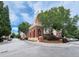Charming exterior view of the building with brick accents and lush landscaping at 1850 Cotillion Dr # 2416, Atlanta, GA 30338