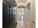 Inviting foyer with tile flooring, arched doorways, and a view into the home at 1850 Cotillion Dr # 2416, Atlanta, GA 30338