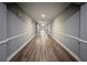 Long hallway featuring modern lighting and wood-look flooring at 1850 Cotillion Dr # 2416, Atlanta, GA 30338