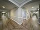 Well-lit hallway with elegant wood floors and neutral wall colors at 1850 Cotillion Dr # 2416, Atlanta, GA 30338