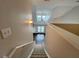 View from stairs to living room with hardwood floors and vaulted ceilings at 1850 Cotillion Dr # 2416, Atlanta, GA 30338